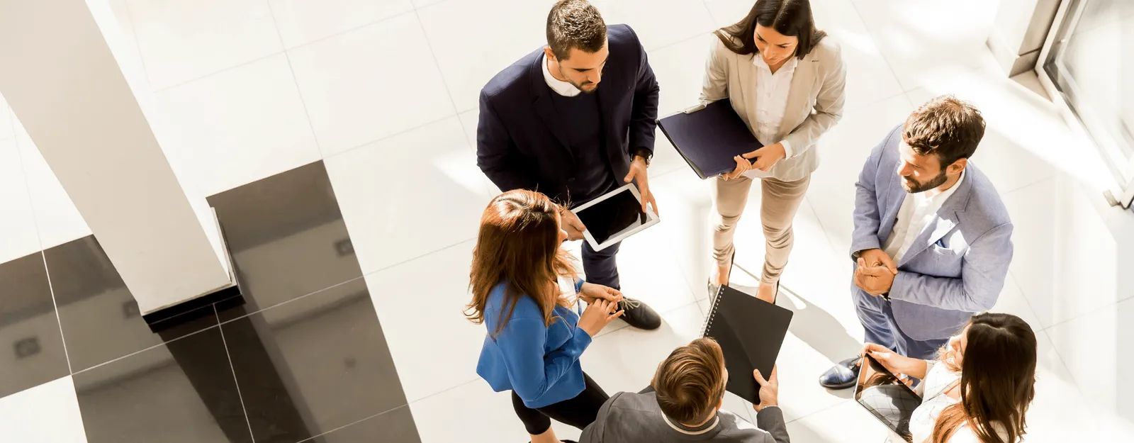A group of people in a business meeting