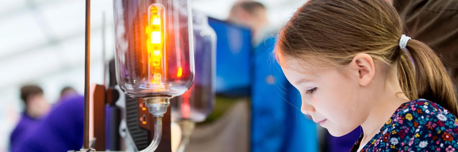 A little girl testing an experiment