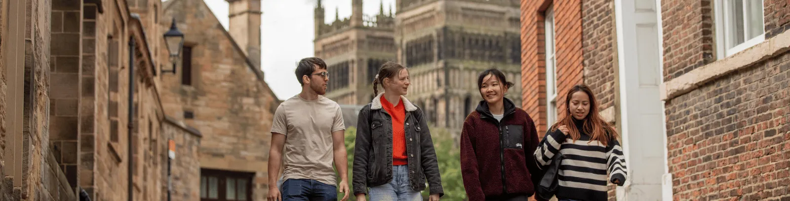 Students walking with Durham Cathedral in the background