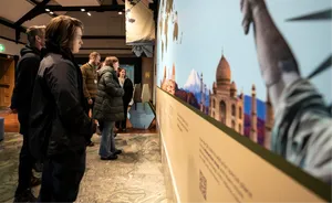 Student reading the interpretation text panels in the Durham World heritage Site visitors Centre