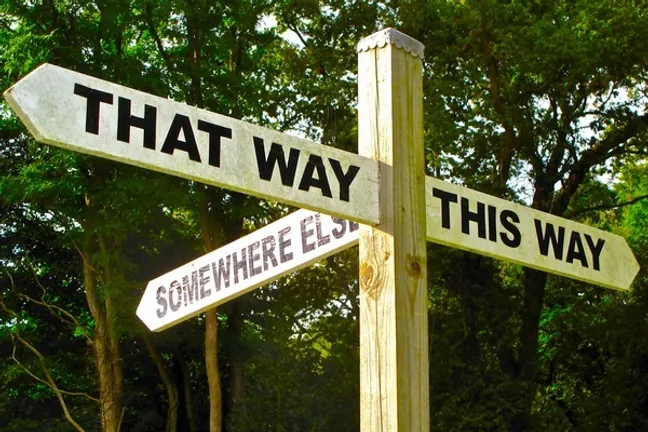 A sign pointing in different directions