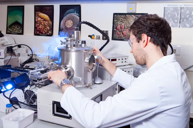 Student using cressington 328 ultra high resolution coating unit