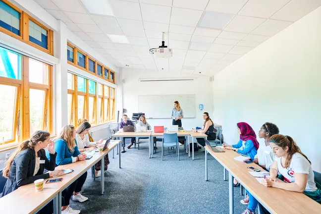 Students taking notes during a seminar