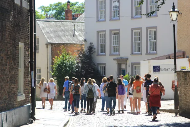A group of new students and their parents exploring Durham City