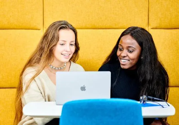 Two students studying in Teaching and Learning Centre
