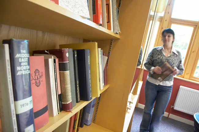 Student walking in library
