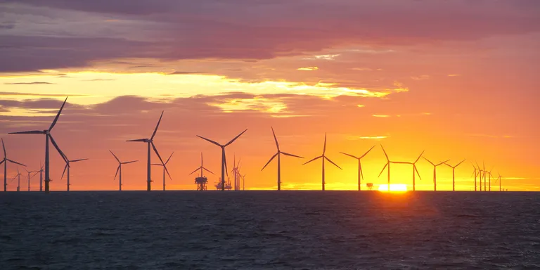 Sunset over an offshore wind farm