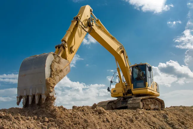 excavator on soil (istock)