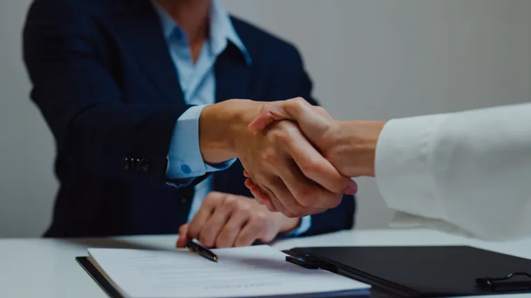 Professional people shaking hands (courtesy of iStock)