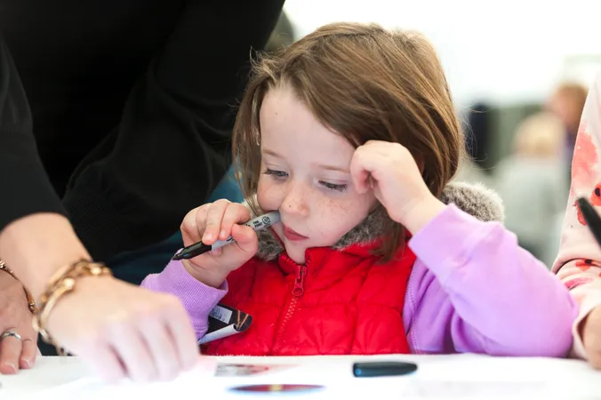 A girl making an optical device