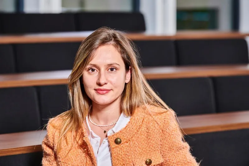 A student sitting in lecture theatre
