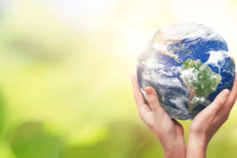 Corporate social responsibility - hands holding globe