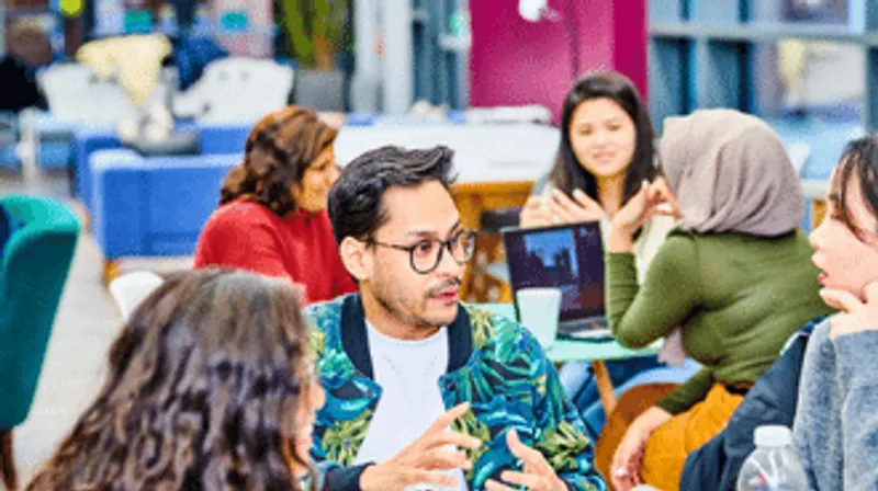 A group of students talking in a social area
