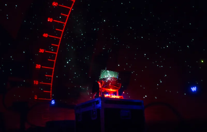 Inside view of the planetarium showing a dark sky and stars