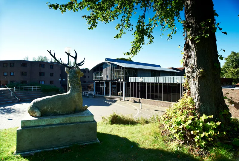 Collingwood College external view with stag statue