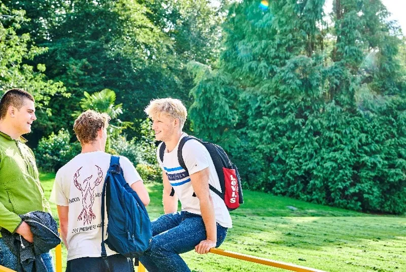 students talking outside Grey