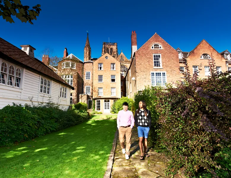 Postgraduate students walking outside St Chad's College