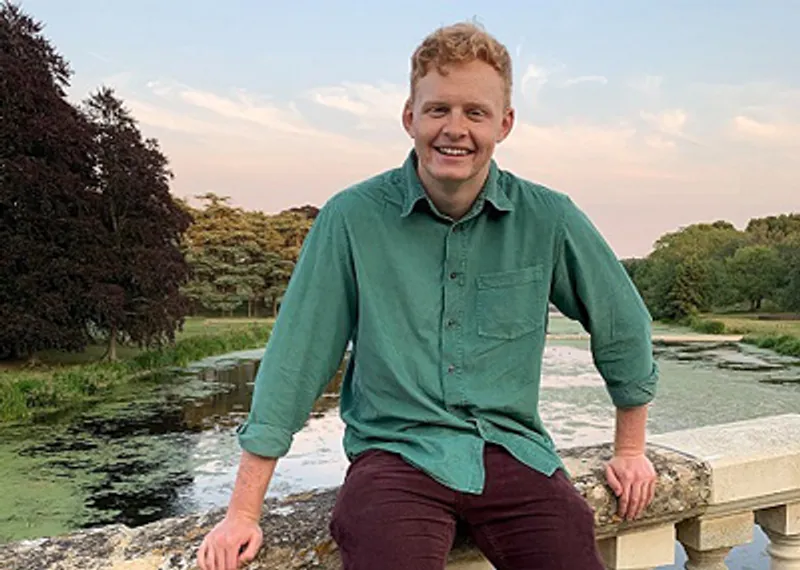 A student testimonial photograph of Henry