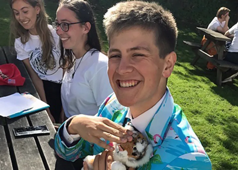 A student testimonial photograph of Michael