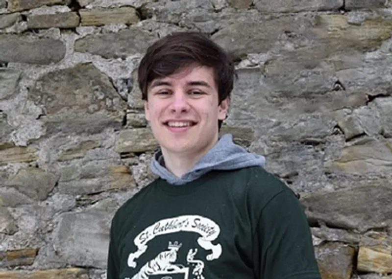 A student testimonial photograph of Sam