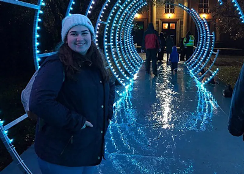 A student testimonial photograph of Sarah