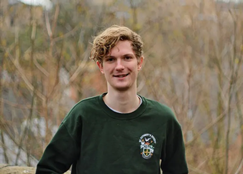 A student testimonial photograph of Tom