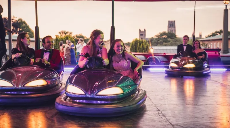 Two St Mary's girls at a fairground in bumper cars