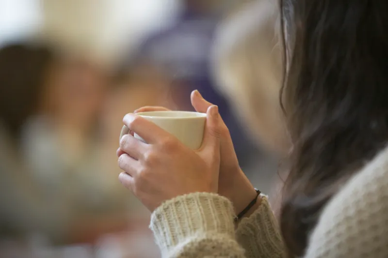 Woman holding a cup of coffee