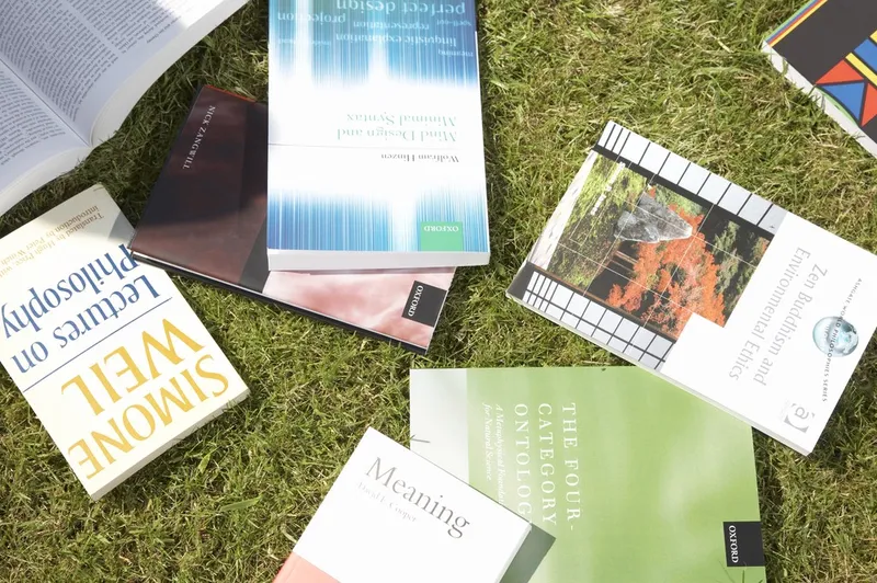 A selection of books that have been scattered on the ground