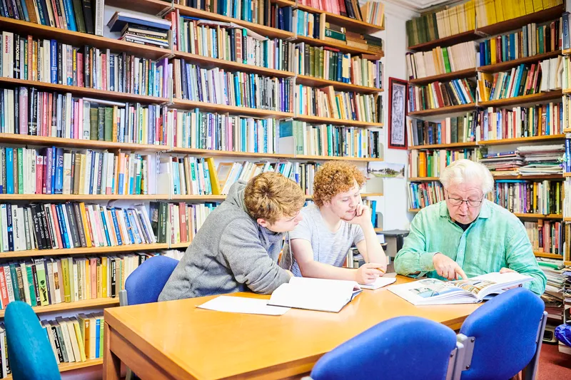 Students talking to professor