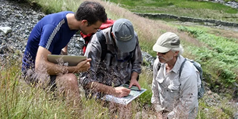 Three people doing field research