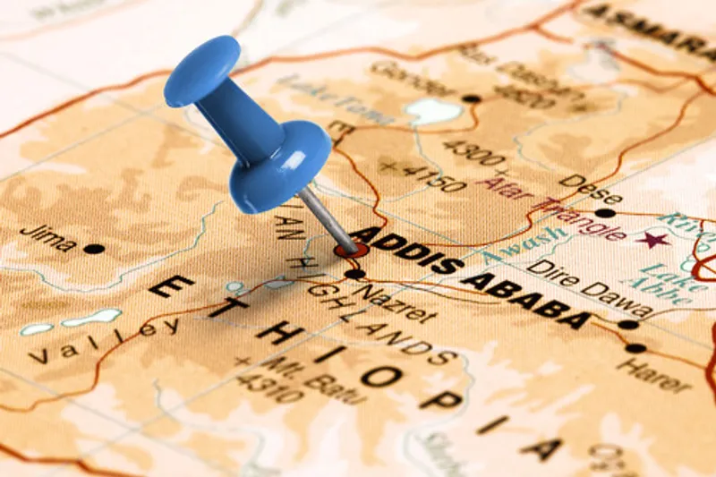 A blue pin shows the location of Addis Ababa on a map