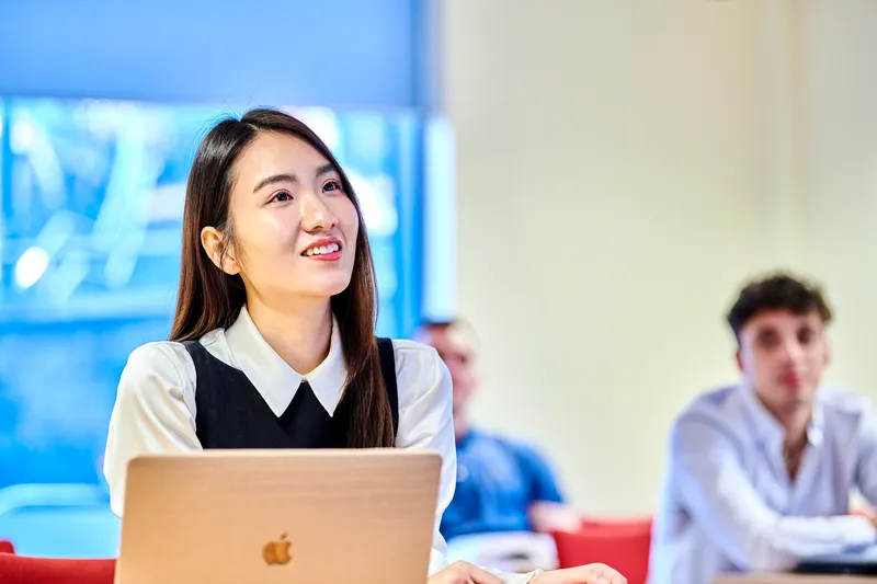 Postgraduate student with laptop