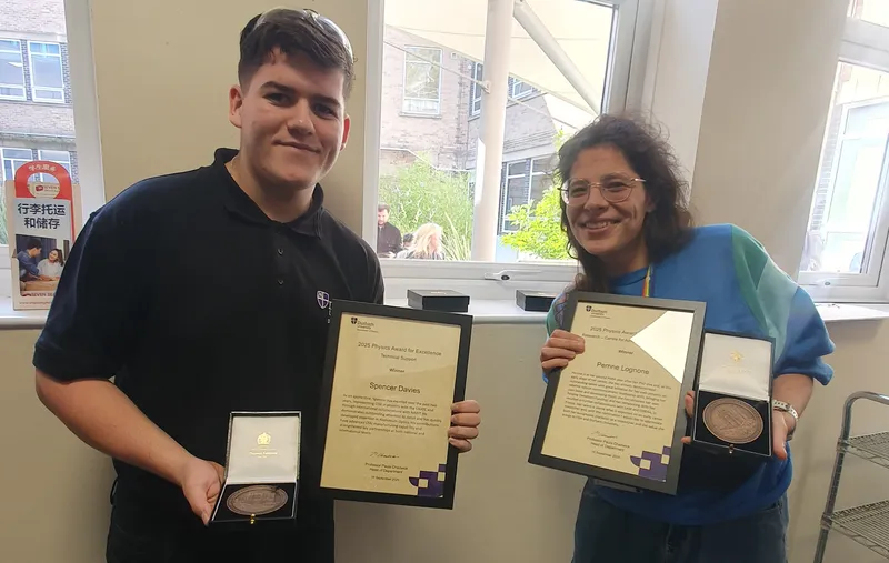 Perrine and Spencer receive physics excellence award
