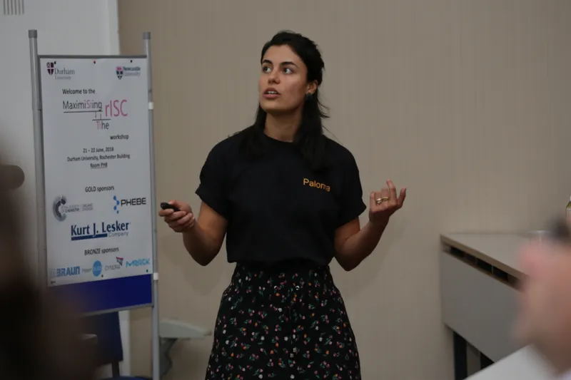 Postgraduate addressing a conference or giving a presentation