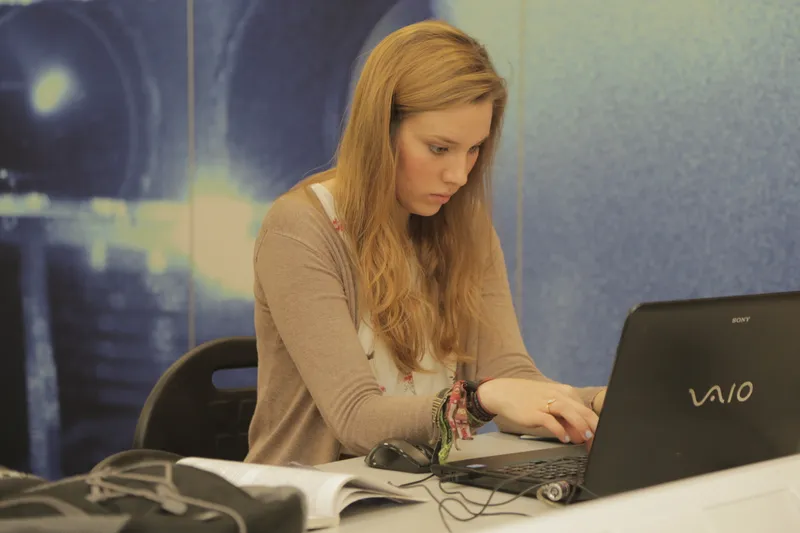 Female undergraduate student on laptop