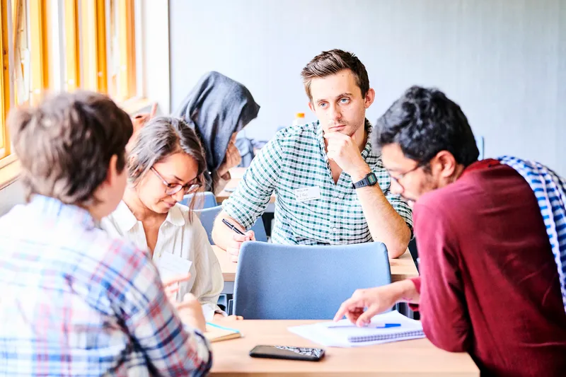 A group of students discussing their thoughts
