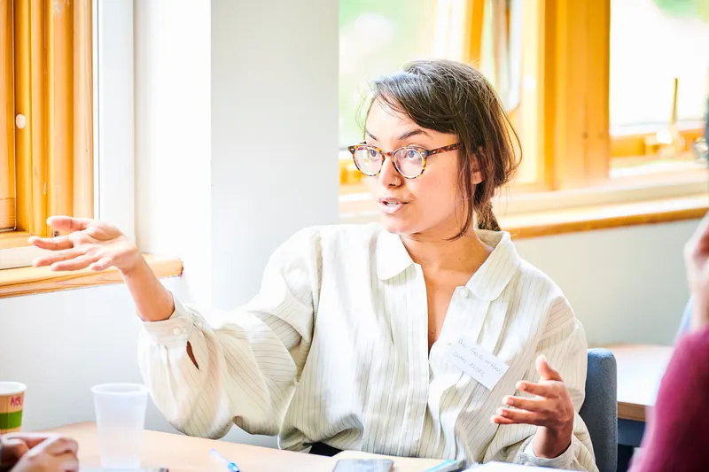 Close up of a student in the midst of a discussion