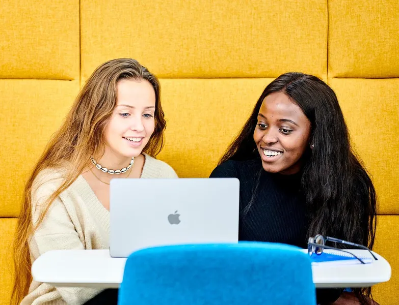 Two students studying in Teaching and Learning Centre