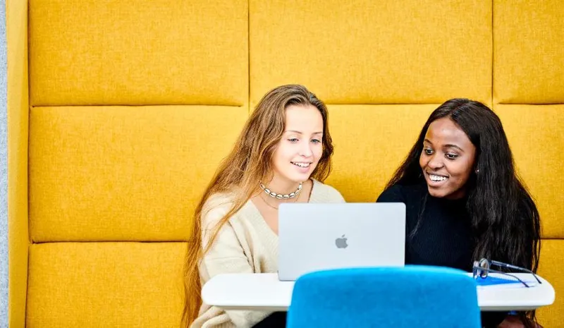 Two students studying in Teaching and Learning Centre