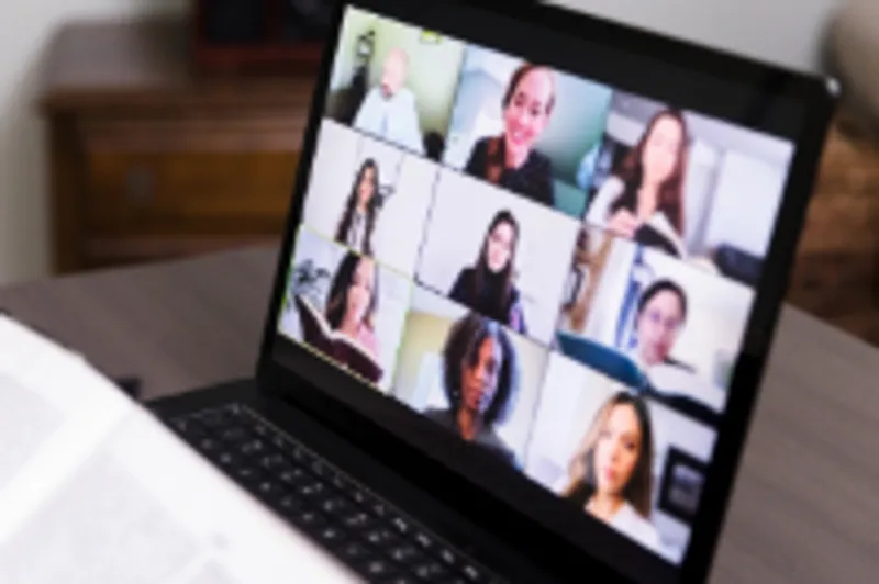 Laptop screen showing meeting participants