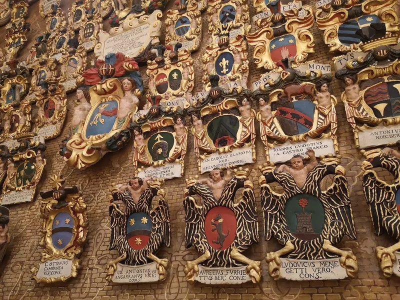 Shields and crests hung in a Padua University lecture theatre