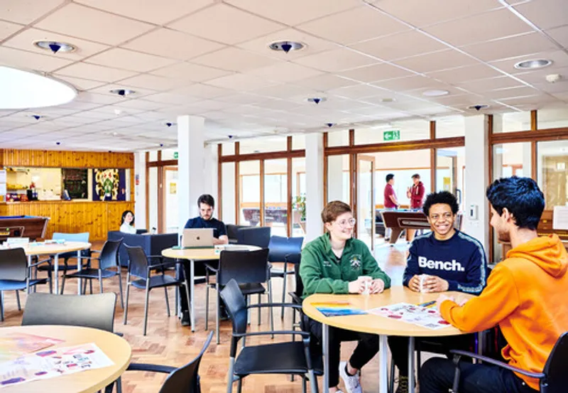 Students sitting at tables in St Aidan's Library