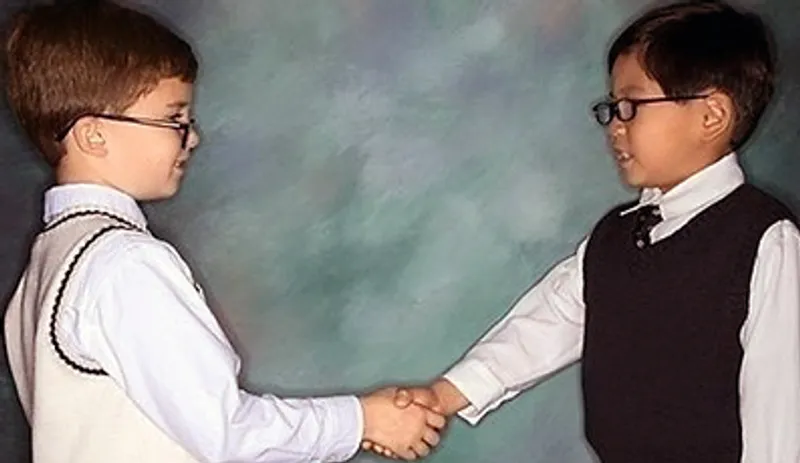 Two children shaking hands
