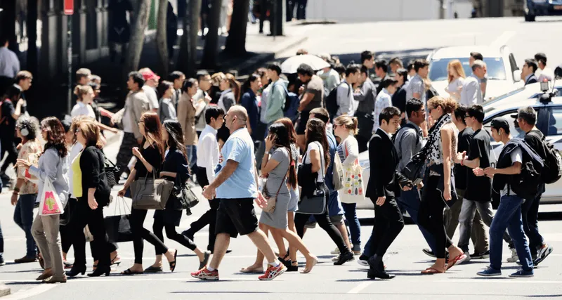 Large group of people crossing the street