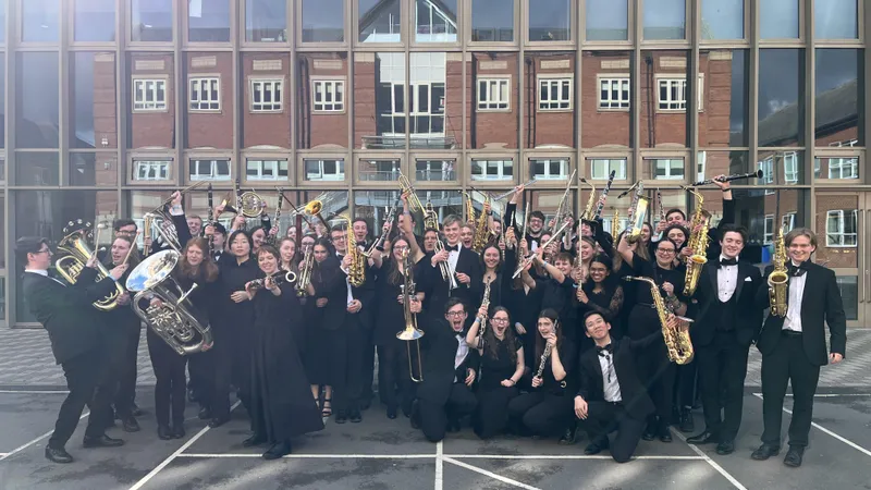 Durham University Concert Band members celebrating receiving a Platinum Award at the annual inter-university concert band competition in 2024.