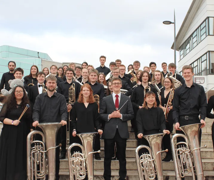 Durham University Brass Band pose for a photo with their instruments outside the UniBrass competition
