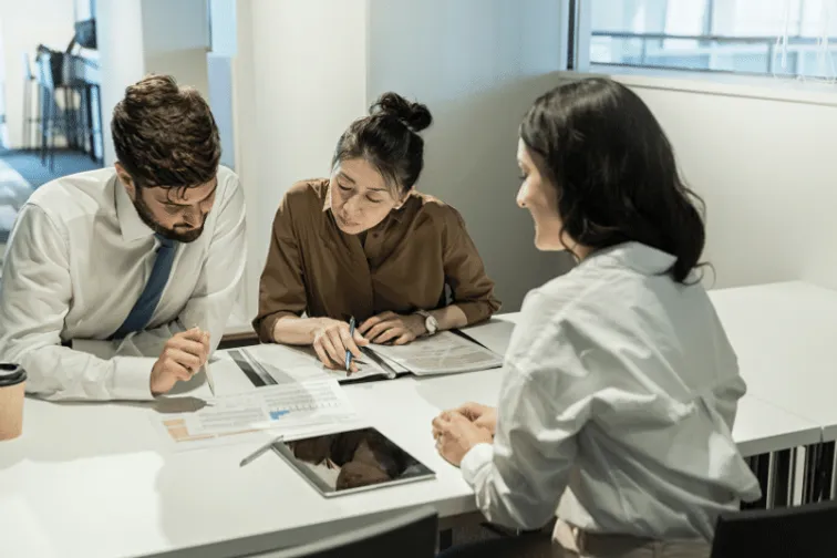 A group of students studying around a table.