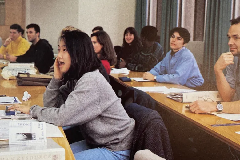 Vintage image of students from 1980/1990 in a lecture looking engaged