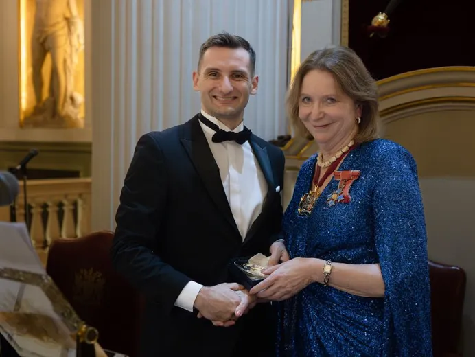 Photograph of Avery Alysworth being presented with his Lombard Prize certificate